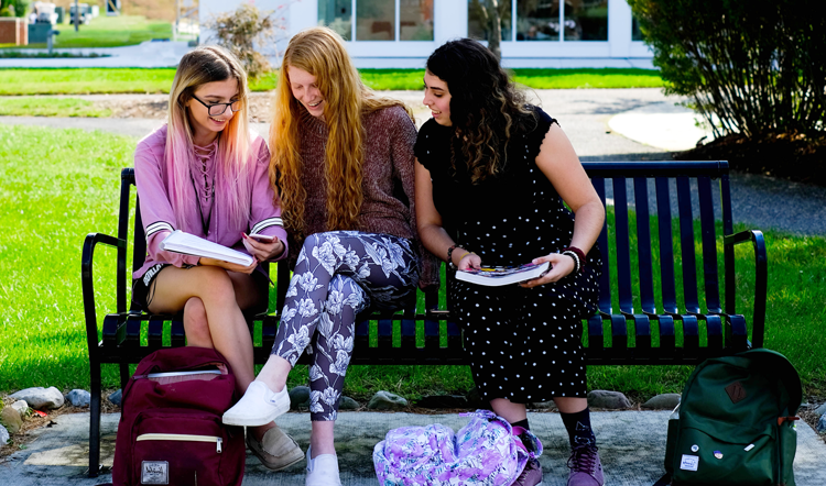 zlmmc8.com three female students studying on a bench on camp at Ocean County College